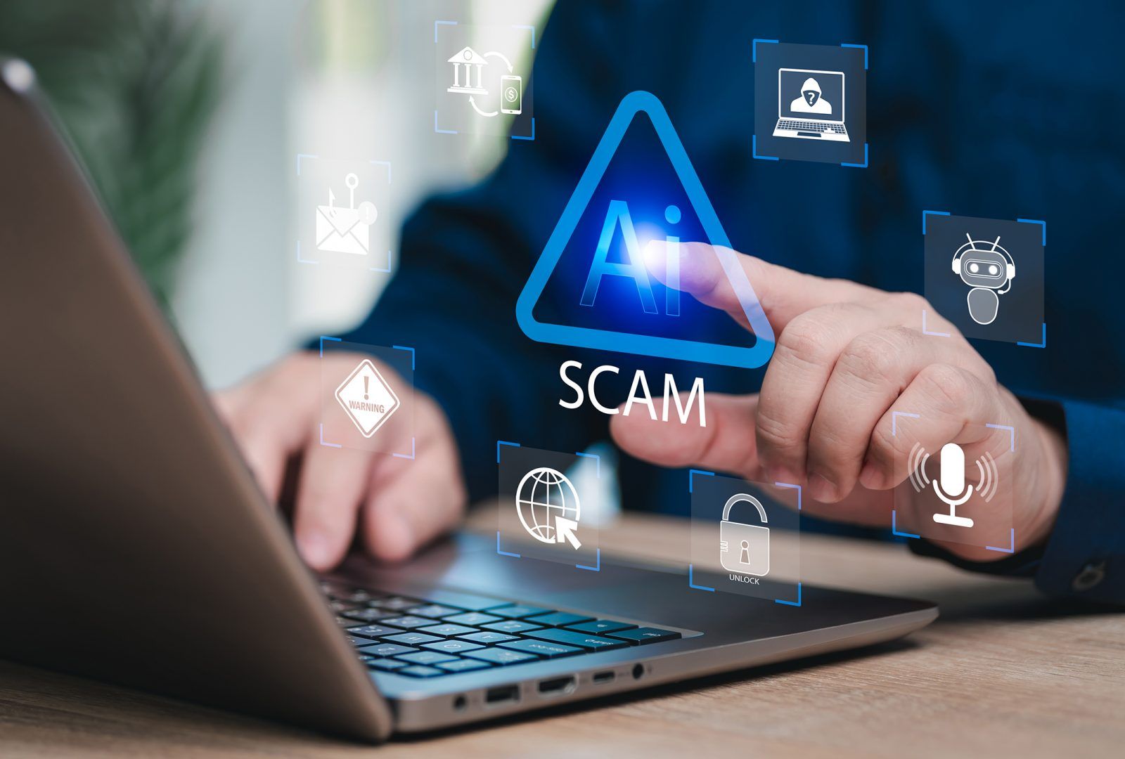 Hands on a computer showing an AI scam alert