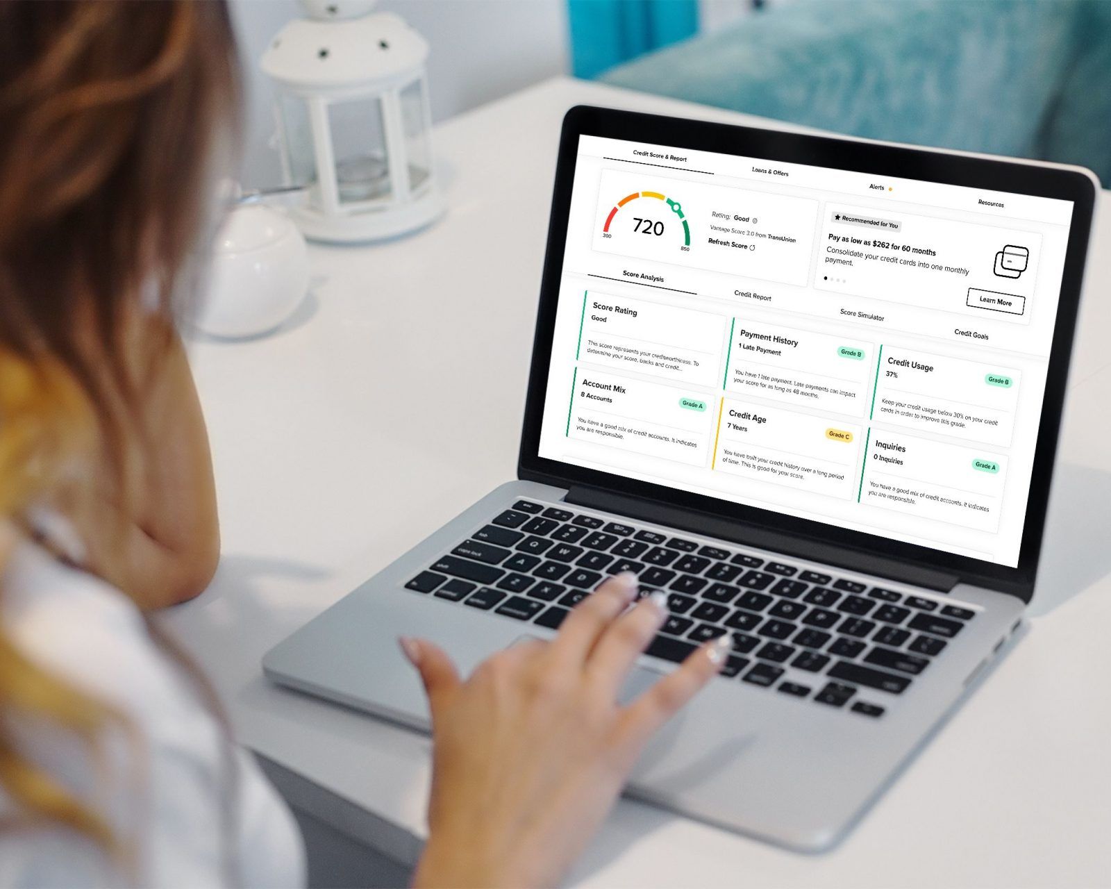 person on a laptop checking their credit score