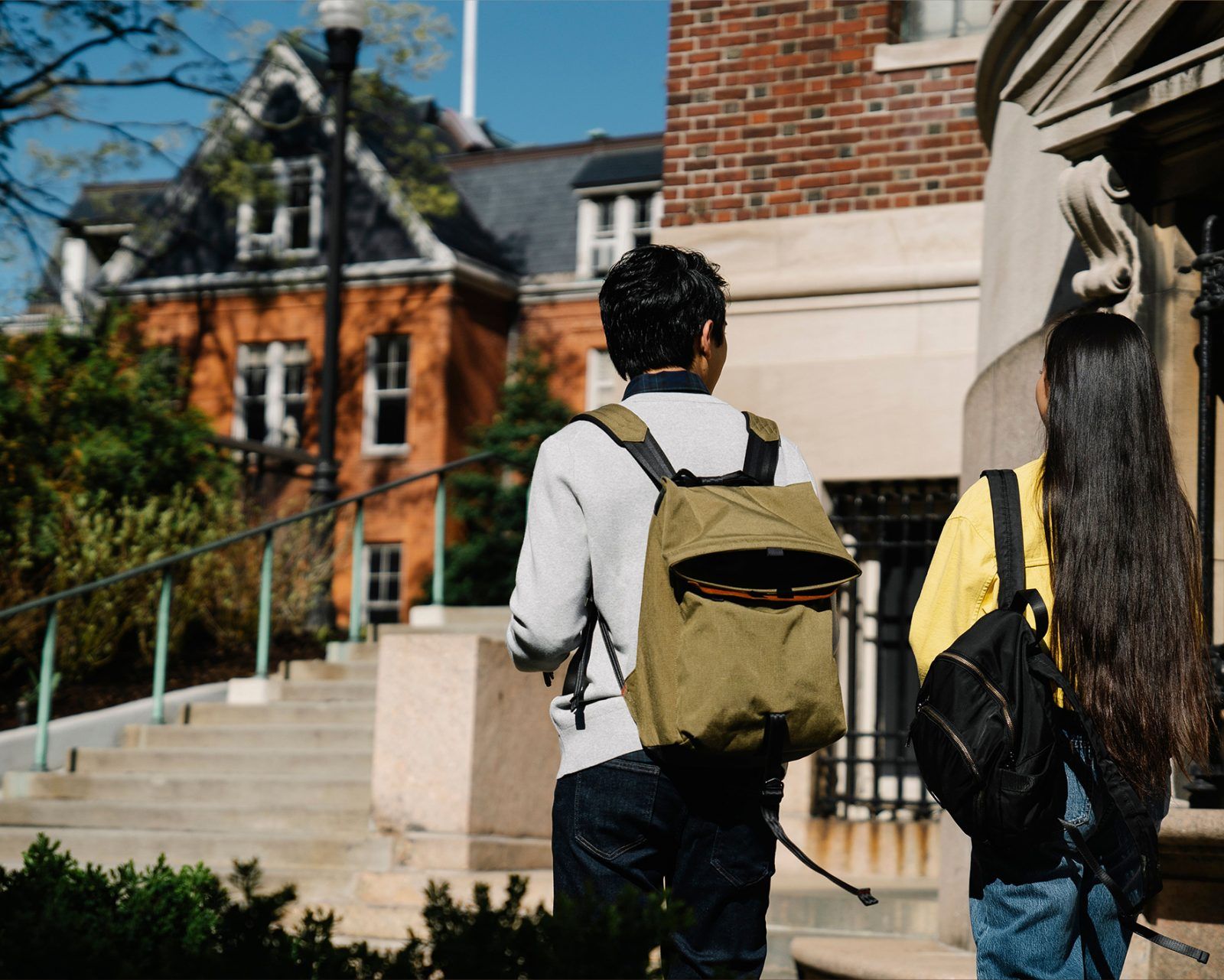 Two students walking in a college campus